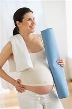 Portrait of pregnant woman exercising.