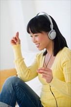 Smiling woman listening music.