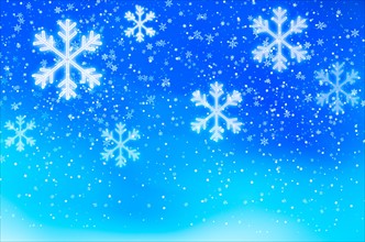 Snowflakes on blue background, studio shot.