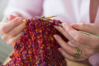 Senior woman knitting, close-up.
