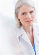 Portrait of senior female doctor .