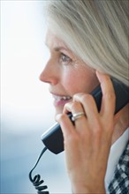 Portrait of senior businesswoman talking on phone.