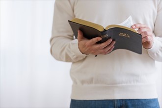 Man holding bible.