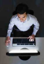 Man working with computer, studio shot.