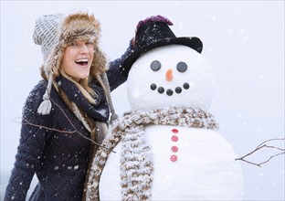 Portrait of woman with snowman.