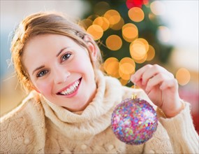 Portrait of beautiful woman wearing wooly sweater. Photo : Daniel Grill