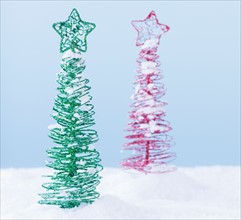 Studio shot of artificial Christmas trees. Photo : Daniel Grill