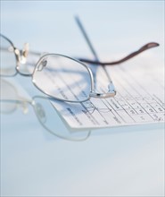 Studio shot of spectacles and prescription. Photo : Daniel Grill