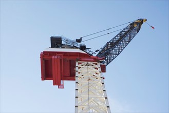 Crane at construction site. Photo : fotog
