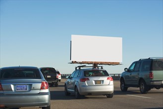 Traffic and blank billboard. Photo : fotog