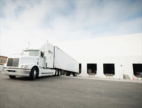 Truck loading in warehouse.