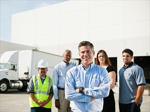 Portrait of warehouse workers and manager.