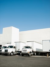 Trucks and warehouse.