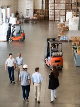 People working in warehouse.