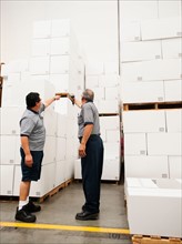Warehouse workers scanning delivery.