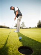 USA, California, Mission Viejo, Man playing golf.