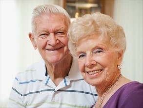 Portrait of senior couple smiling.