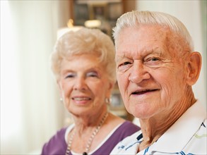 Portrait of senior couple smiling.