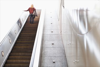 USA, California, Los Angeles, Woman on escalator in subway station. Photo : Sarah M. Golonka