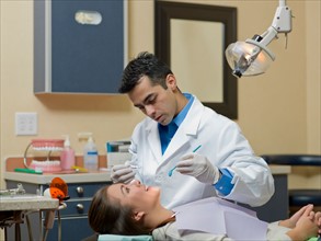 Dentist and patient in dental surgery. Photo : Dan Bannister