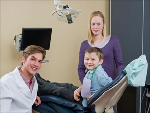Dentist and patients in dental surgery. Photo : Dan Bannister