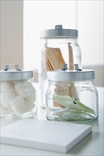 Cotton swabs and tongue depressors in jars. Photo : Rob Lewine
