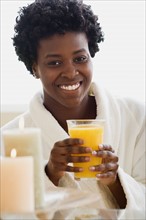 Woman drinking juice in spa. Photo : Rob Lewine