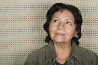 Portrait of older woman lost in thoughts. Photo : Rob Lewine