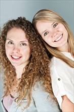 Studio portrait of two young women. Photo : Elena Elisseeva