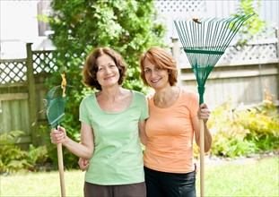 Toronto, Ontario, Two gardening woman in backyard. Photo : Elena Elisseeva