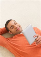 Man reading e-book.