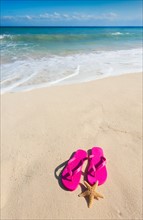 Mexico, Yucatan. Sandals with starfish on beach.