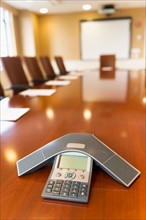 Conference phone on conference table.