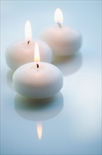 Studio shot of white candles.