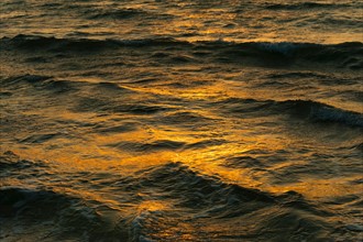 Mexico, Yucatan. Surface of water at sunset.