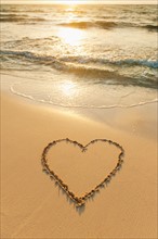 Mexico, Yucatan. Heart drawn in sand on beach.