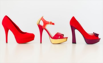 Studio shot of red high heel shoes.