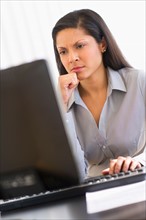 Businesswoman working on computer.