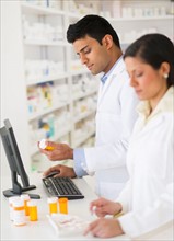 Two pharmacists in pharmacy.