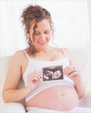 Pregnant woman with ultrasonography scan. Photo : Daniel Grill