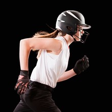 Portrait of girl (12-13) plying softball. Photo : Mike Kemp