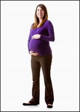 Portrait of pregnant woman, studio shot. Photo : Mike Kemp