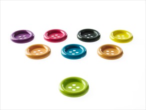 Studio shot of medium group of multi colored buttons. Photo : David Arky