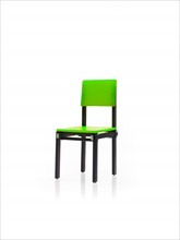 Studio shot of single green chair. Photo : David Arky