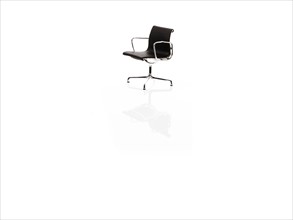 Single corporate chair on white background. Photo : David Arky