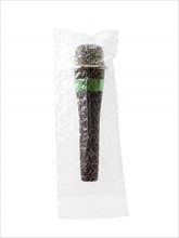 Studio shot of unplugged microphone still in bubble bag. Photo : David Arky