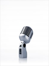 Studio shot of vintage-themed modern microphone on white background. Photo : David Arky