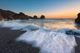 USA, Oregon, Curry County. Blurred surf wave washing ashore. Photo : Gary Weathers