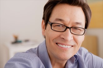 Portrait of man smiling. Photo : Rob Lewine