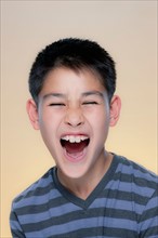 Portrait of laughing boy. Photo : Rob Lewine